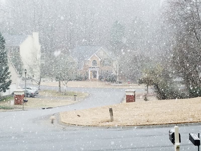 The snow is coming down in Lawrenceville as a winter weather system makes its way across metro Atlanta and North Georgia on Saturday, February 8, 2020.
