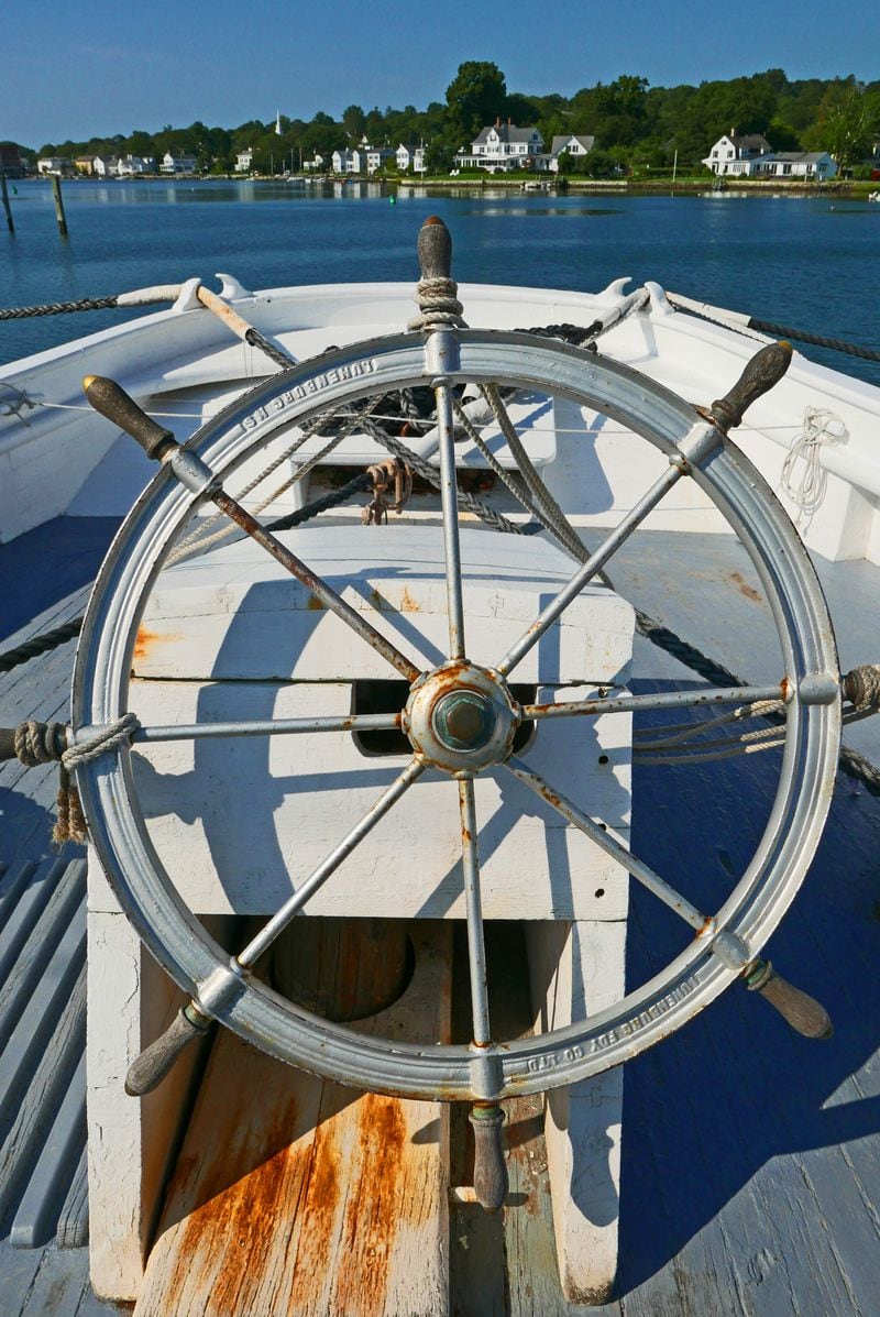The wheel of the L.A. Dunton, a fishing schooner built in Essex, Mass., in 1921 and one of the four National Historic Landmark vessels at the museum. (Alan Behr/TNS)