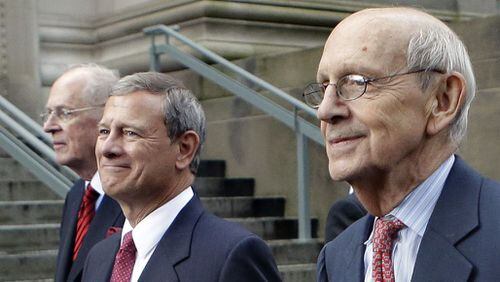 Supreme Court Justices Anthony Kennedy, left, and Stephen Breyer, right, walk with Chief Justice John Robert during a procession last week at Harvard Law School. (Steven Senne / Associated Press)