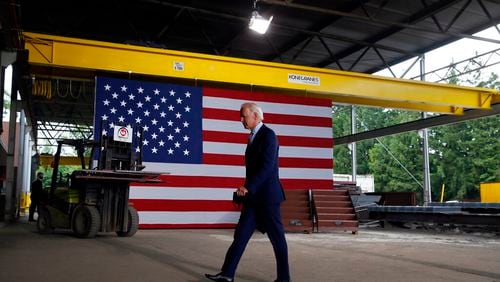 FILE - In this July 9, 2020, file photo Democratic presidential candidate former Vice President Joe Biden walks from the podium after speaking at McGregor Industries in Dunmore, Pa. Biden is pledging to define his presidency by a sweeping economic agenda beyond anything Americans have seen since the Great Depression and the industrial mobilization for World War II.  (AP Photo/Matt Slocum, File)