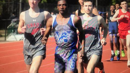 (L-R) Elias Podber of Grady, Zachary Hall of Westlake and Bram Mansbach of Grady, all seniors, lead the pack in the 1,600 meters at the Panther All-Comers Meet, held February 22. It was one of the last meets held prior to the suspension of the school year due to COVID-19. Mansbach (4:38.45) edged Hall (4:38.49) for first while Westlake junior Taylor Battle placed third and Podber took fourth .