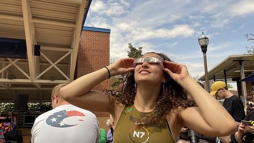 Chattanooga State student Aiyana Loher looks at the partial solar eclipse from the Chattanooga State Community College campus Monday. (Photo Courtesy of Shannon Coan)