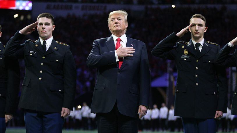 January 8, 2018 Atlanta: President Donald Trump participates in the National Anthem at the College Football Playoff National Championship on Monday, January 8, 2018, in Atlanta.    Curtis Compton/ccompton@ajc.com