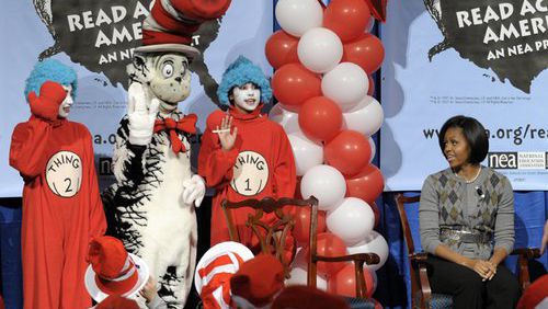 Former First lady Michelle Obama at "The Cat in the Hat" and "Thing 1 and Thing 2" during the National Education Association's 2010 Read Across America Day at the Library of Congress in Washington.