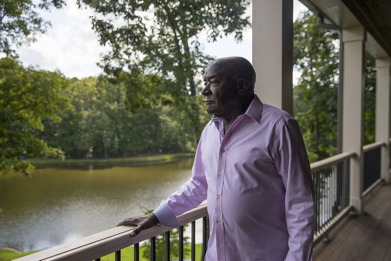 Former Coke senior executive Carl Ware looks over a lake on his residential property in Newnan. Ware recently wrote a book, “Portrait of an American Businessman: One Generation from Cotton Field to Boardroom,” detailing his life and his time at the Coca-Cola Company. (Alyssa Pointer/alyssa.pointer@ajc.com)