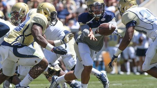 Georgia Tech Yellow Jackets quarterback Justin Thomas (5) pitches the ball to Georgia Tech Yellow Jackets Isiah Willis (3), not pictured, during the 2016 Spring Game at Bobby Dodd Stadium on Georgia Tech's campus, Saturday, April 23, 2016, in Atlanta. BRANDEN CAMP/SPECIAL