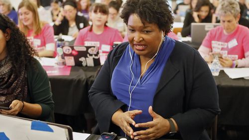 November 21, 2019 - Atlanta - Stacey Abrams makes some calls at the phone bank. Democratic presidential candidates including Cory Booker, Amy Klobuchar, Andrew Yang and Pete Buttigieg, along with Stacey Abrahms, were calling and texting voters Thursday whose registrations could be canceled in Georgia at a Fair Fight phone bank at Ebenezer Baptist Church in Atlanta. The phone bank was in response to Georgia election officials' plan to cancel more than 313,000 voter registrations next month. Bob Andres / robert.andres@ajc.com