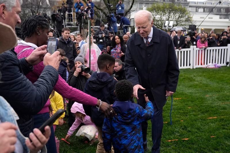 President Joe Biden, right, greets children at the White House Easter Egg Roll on the South Lawn of the White House, Monday, April 1, 2024, in Washington. (AP Photo/Evan Vucci)