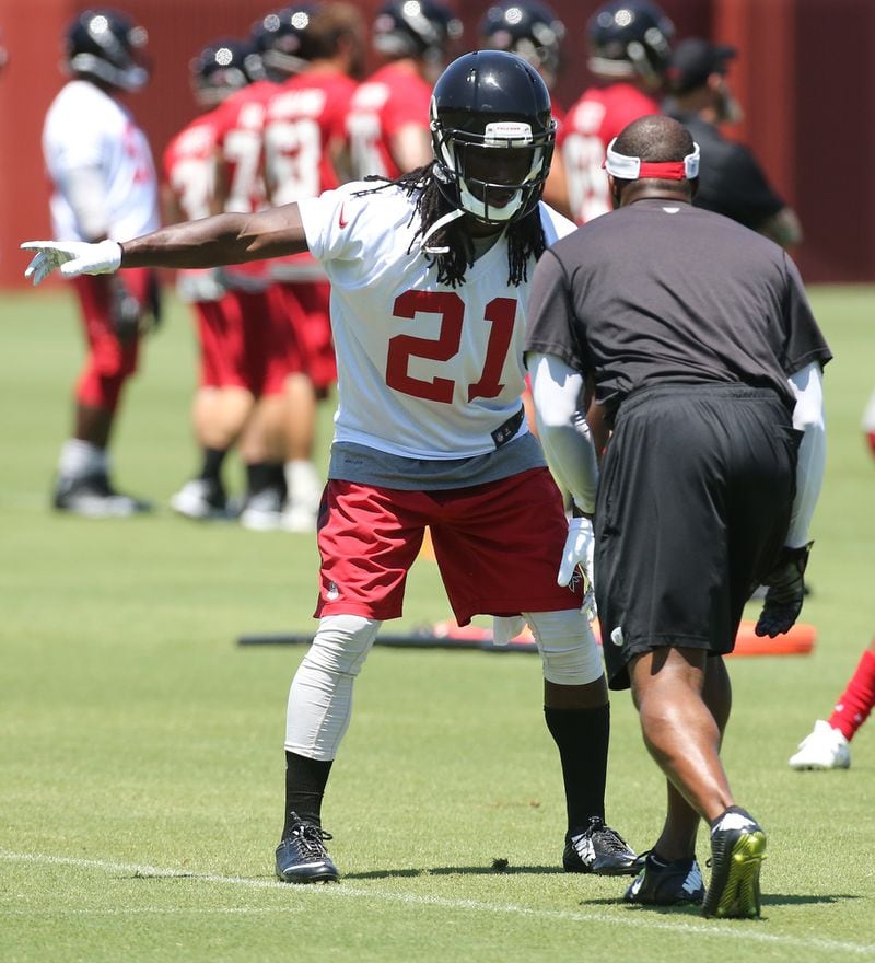  060716 FLOWERY BRANCH: Falcons cornerback Desmond Trufant works on defensive drills with secondary coach Marquand Manuel during an OTA day on Tuesday, June 7, 2016, in Flowery Branch. Curtis Compton / ccompton@ajc.com