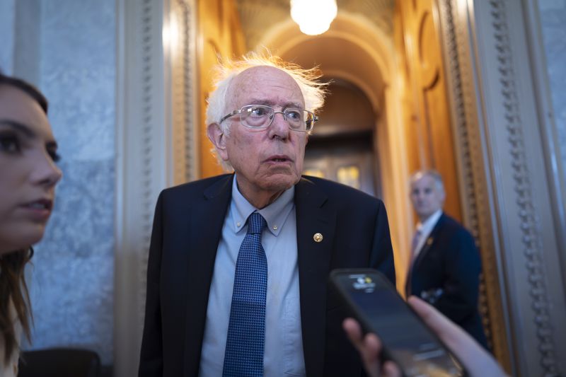 Sen. Bernie Sanders, I-Vt., speaks with reporters as the Senate prepares to advance the $95 billion aid package for Ukraine, Israel and Taiwan passed by the House, at the Capitol in Washington, Tuesday, April 23, 2024. (AP Photo/J. Scott Applewhite)