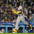 Atlanta Braves' Ronald Acuna Jr. runs the bases after hitting a home run during the eighth inning of a baseball game against the Los Angeles Dodgers in Los Angeles, Friday, May 3, 2024. (AP Photo/Ashley Landis)