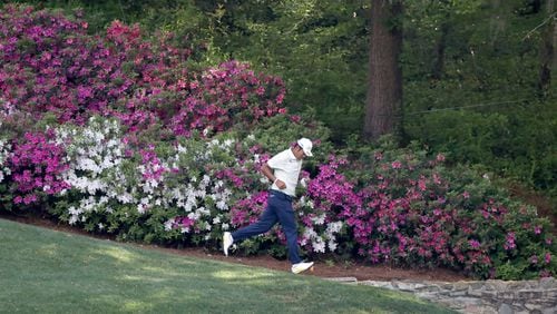 Hideki Matsuyama runs down the 13th fairway after his tee shot during the Masters Tournament Sunday, April 11, 2021, at Augusta National Golf Club in Augusta. (Curtis Compton/ccompton@ajc.com)