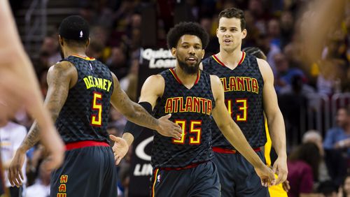 CLEVELAND, OH - APRIL 7: Malcolm Delaney #5 DeAndre' Bembry #95 and Kris Humphries #43 of the Atlanta Hawks celebrate after scoring during the first half against the Cleveland Cavaliers at Quicken Loans Arena on April 7, 2017 in Cleveland, Ohio. NOTE TO USER: User expressly acknowledges and agrees that, by downloading and/or using this photograph, user is consenting to the terms and conditions of the Getty Images License Agreement. (Photo by Jason Miller/Getty Images)