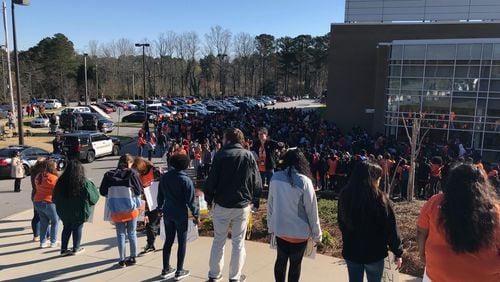 More than 1,000 students, faculty, staff and community leaders assemble for an anti-gun violence demonstration at Lakeside High School Wednesday morning. (MARLON A. WALKER/marlon.walker@ajc.com)