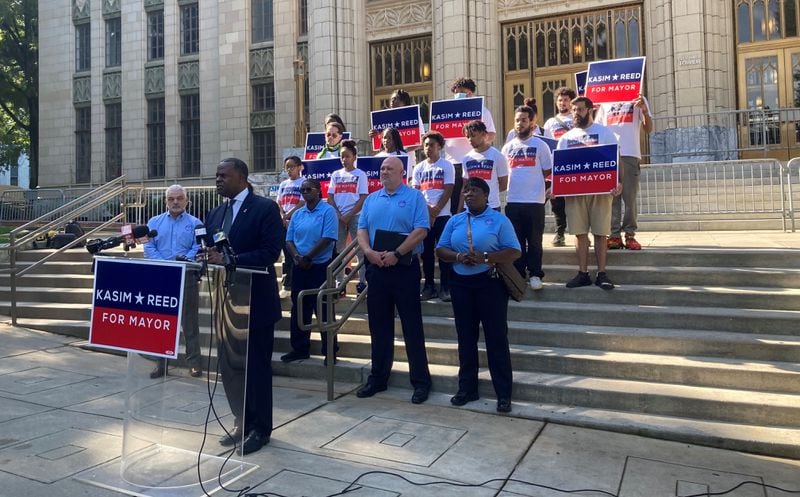 Former Atlanta mayor Kasim Reed stands with supporters outside City Hall on Thursday to accept the endorsement of the police union that represents most Atlanta officers. (J.D. Capelouto/jdcapelouto@ajc.com)