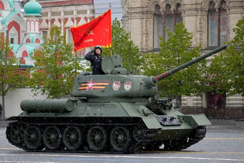 A legendary Soviet era T-34 tank with a red flag atop rolls during the Victory Day military parade in Moscow, Russia, Thursday, May 9, 2024, marking the 79th anniversary of the end of World War II. (AP Photo/Alexander Zemlianichenko)