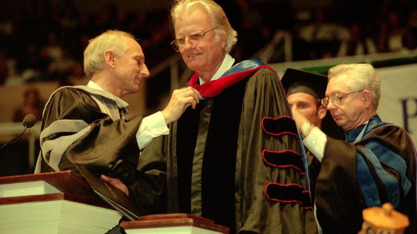 The Rev. Billy Graham was presented an honorary doctorate degree on Saturday, April 26, 1997, by Palm Beach Atlantic College President Paul Corts during graduation ceremonies in West Palm Beach. (Scott Wiseman/1997 Palm Beach Post file photo)