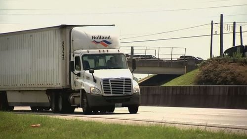 Gov. Brian Kemp signed a bill into law Friday that temporarily allows heavier trucks on Georgia highways.