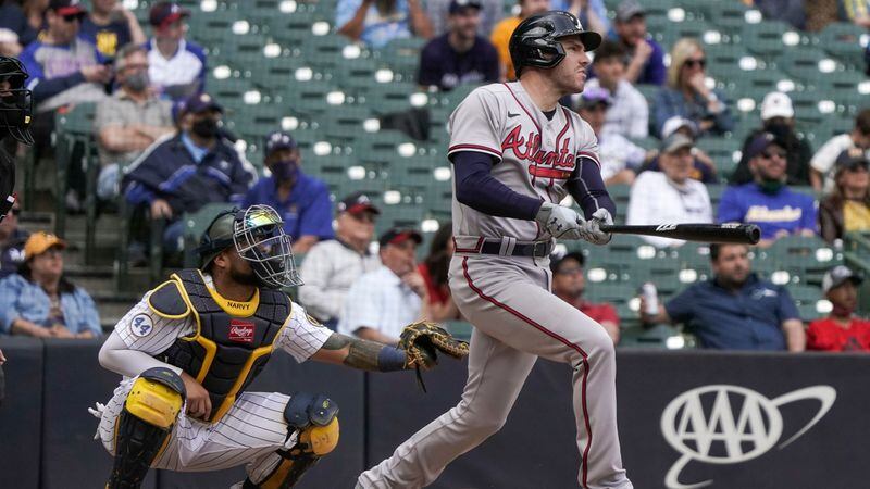 Braves first baseman Freddie Freeman hits a grand slam during the seventh inning against the Milwaukee Brewers Sunday, May 16, 2021, in Milwaukee. Atlanta lost 10-9. (Morry Gash/AP)