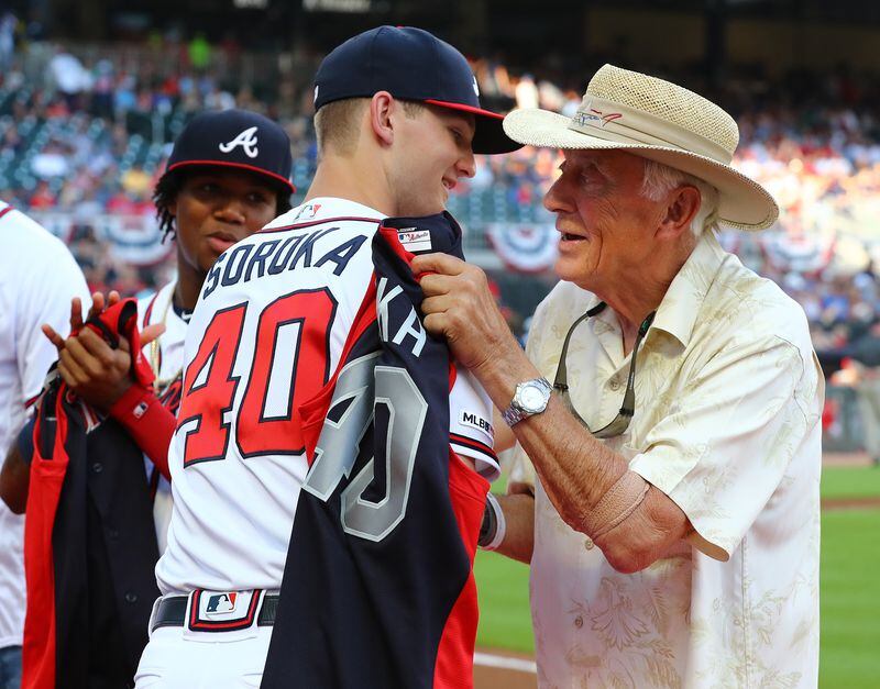 Braves pitcher Mike Soroka receives his All-Star jersey from Braves great Phil Niekro. (Curtis Compton/ccompton@ajc.com)