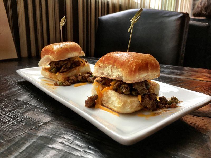 The sloppy keema sliders combine sweet minced lamb and shredded English cheddar on a thick, soft bun at Blue India. CONTRIBUTED BY WYATT WILLIAMS