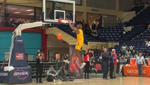Jeff Davis' Ja'Queze Kirby dunks during the GHSA's annual slam dunk contest on Saturday, March 7, 2020 at the Macon Centreplex. (Adam Krohn for the AJC)