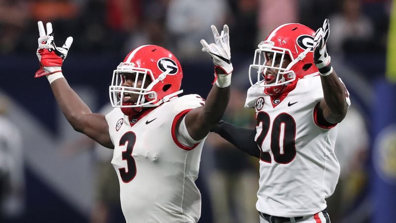Georgia Bulldogs linebacker Roquan Smith (3) leads the defense in a celebration after recovering an Auburn Tigers fumble during the second half of the SEC Championship game Dec. 2, 2017, at Mercedes-Benz Stadium in Atlanta.  