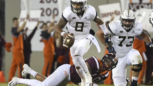 Georgia Tech's Tobias Oliver leaves another Virginia Tech defender in his wake Thursday night.(Michael Shroyer/Getty Images)