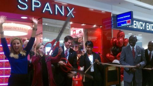 Spanx founder Sara Blakely, far left, celebrates the opening of the first airport Spanx store during a hosiery ribbon-cutting event at Hartsfield-Jackson International Airport in December 2012.