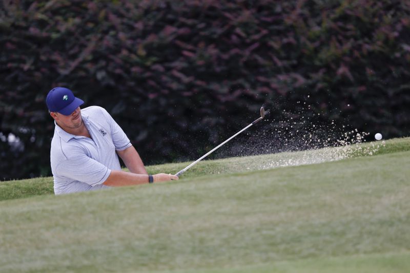 Toby Walker, Australia, who finished 24th, hits from the sand trap on the seventh hole during the final round of the Dogwood Invitational Golf Tournament in Atlanta on Saturday, June 11, 2022.   (Bob Andres for the Atlanta Journal Constitution)
