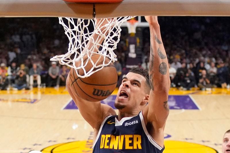 Denver Nuggets forward Michael Porter Jr. dunks during the second half in Game 4 of an NBA basketball first-round playoff series against the Los Angeles Lakers Saturday, April 27, 2024, in Los Angeles. (AP Photo/Mark J. Terrill)