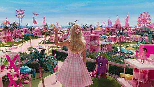 Margot Robbie as Barbie starts with a perfect fantastical life in "Barbie." Warner Bros. Entertainment