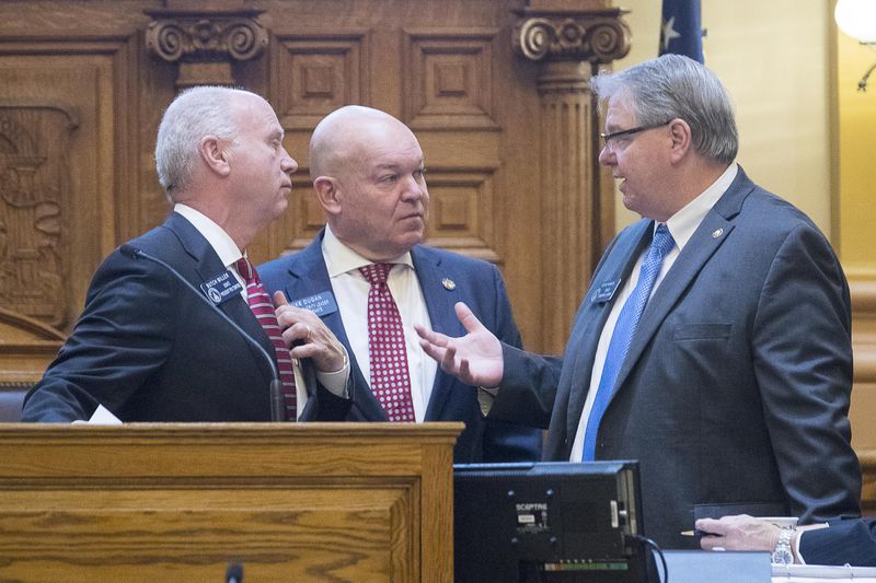 01/14/2019 -- Atlanta, Georgia -- Senate Pro Temper Butch Miller (left), Senate majority leader Mike Dugan (center) and Senate minority leader Steve Hensons (right) have a discussion over Senate Bill 4 during the first session of the season in the Senate chambers at the State Capitol building, Monday, January 14, 2019. (ALYSSA POINTER/ALYSSA.POINTER@AJC.COM)