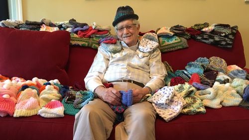 Ed Moseley, 86, recently taught himself to knit to make caps for newborns in the intensive care unit at Northside Hospital.