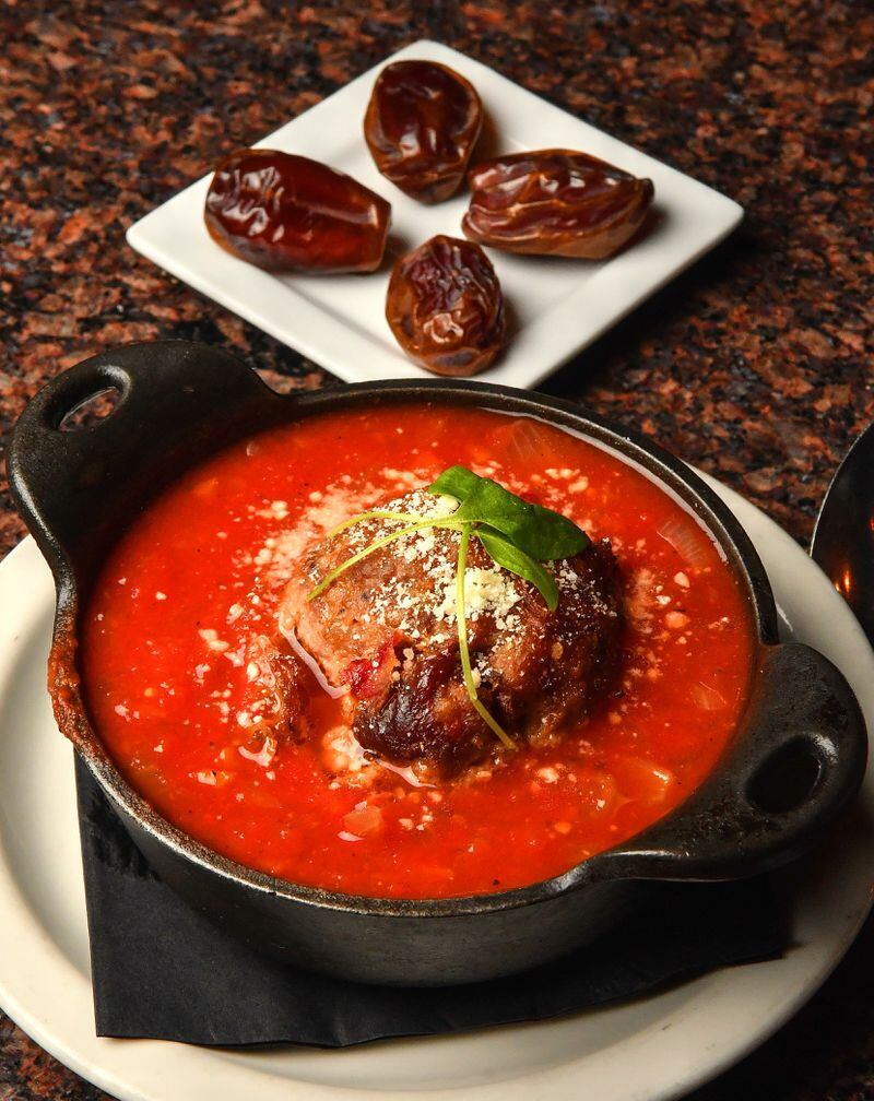 The sweetness of dates plays a role in Meatball al Sugo, an appetizer at the restaurant Sugo. (Styling by chef Ricardo Soto / Chris Hunt for the AJC)