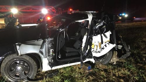 A Forsyth County Sheriff's Office deputy  was injured early Saturday when a vehicle driven by a suspected DUI driver crashed into his parked patrol car on Ga. 400.