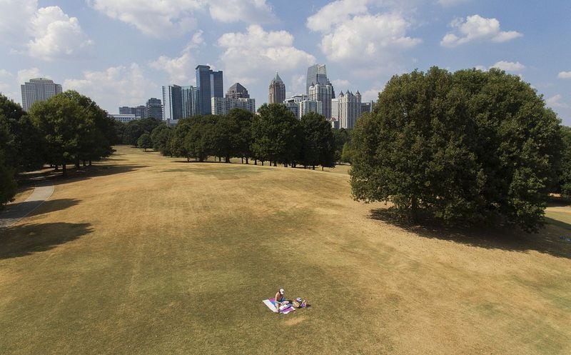 A man sunbathes amid patches of dried-out lawn from a lack of rain in Atlanta on Oct. 3, 2019. Scientists say more than 45 million people across 14 Southern states are now in the midst of a drought that’s cracking farm soil, drying up ponds and raising the risk of wildfires. AP PHOTO / DAVID GOLDMAN