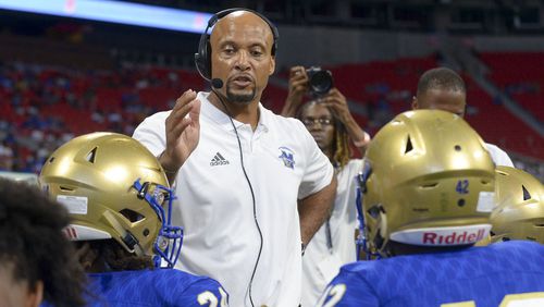 McEachern head coach Franklin Stephens talks to his players during a time out during a Corky Kell Classicgame Saturday, Aug. 24, 2019, at Mercedes-Benz Stadium in Atlanta.