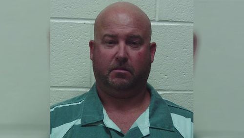 Chad Haufler, 45, is charged with murder after a shooting inside a home on Lake Oconee.