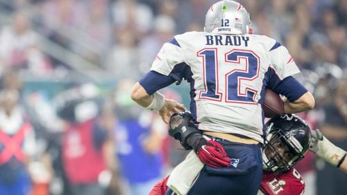 Atlanta Falcons 97 Grady Jarrett sacks New England Patriots Tom Brady in the 4th quarter on Sunday, Feb. 5 , 2017 during the NFL Super Bowl LI football game at the NRG Stadium in Houston, Texas. RICARDO B. BRAZZIELL/AMERICAN-STATESMAN