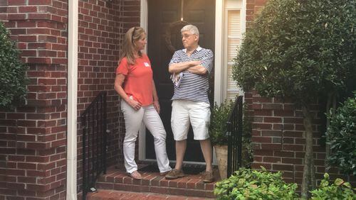Lynne Homrich, a Republican running in the 7th Congressional District, talks to Bill Schilleci at his home in Forsyth County. Homrich, like other Republicans running in the district, has positioned herself as a supporter of President Donald Trump and an opponent to efforts to impeach him. That was something Schilleci wanted to hear. “It’s chaos,” he said. “This impeachment thing started before Donald Trump put his hand on the Bible.” Impeachment is also an issue Democrats are running on in Georgia to varying degrees.