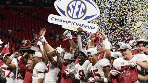 Alabama players celebrate after defeating Georgia in the 2018 SEC championship game.