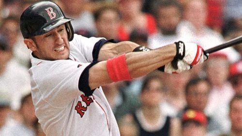 Nomar Garciaparra of the Boston Red Sox connects on his second home run of the day, during the fifth inning of Boston's 7-2 win over the Atlanta Braves at Fenway Park in Boston on Sunday, July 9, 2000. (AP Photo/Winslow Townson)
