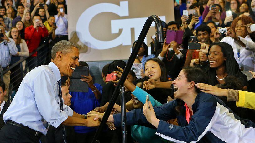 Students reach out for President Barack Obama as he takes the stage. Curtis Compton / ccompton@ajc.com