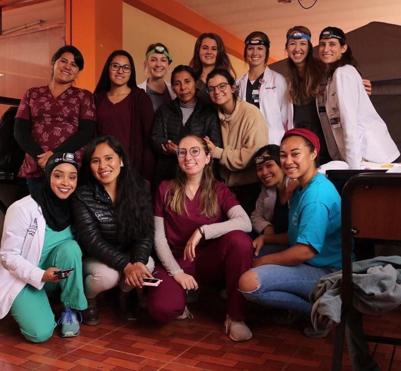 Georgia college students in Cusco, Peru, with local medical personnel and a coordinator from California: Among the nine students pictured are Aya Mansour (front row, center), 22, of Lawrenceville, who attends the University of Georgia and, from Augusta University, are Nurin Ghazzawi (front row, left), 26, of Duluth; Erica West (back row, third from left), 25, of Alpharetta; and Erin Hill (back row, center), 26 of Warner Robins. CONTRIBUTED