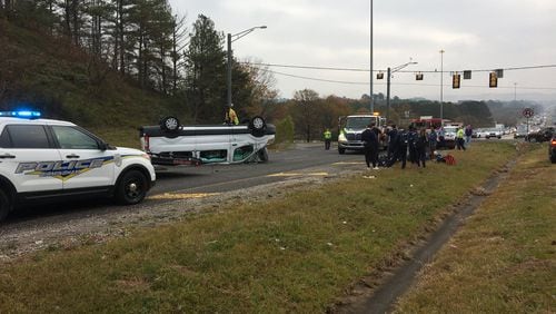 A van carrying members of the Emory University track team overturned Friday in Birmingham, Ala.