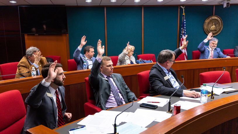 Members of the House Governmental Affairs Committee vote Wednesday to pass Senate Bill 222, which would ban private donations to county election offices. (Arvin Temkar / arvin.temkar@ajc.com)