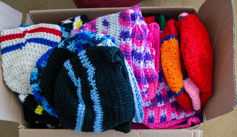 Margrit Ottwiller has crocheted hats throughout the pandemic to give to charity. She has more than 100 and donated them to Community Friendship, an organization that provides many psychiatric rehabilitative services here in Atlanta.  PHIL SKINNER FOR THE ATLANTA JOURNAL-CONSTITUTION.