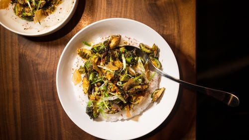 Chef Jarrett Stieber's Winter Vegetables with Rice Porridge, Scallion, Peanut and Korean Chili Flake. / Photo credit- Mia Yakel.