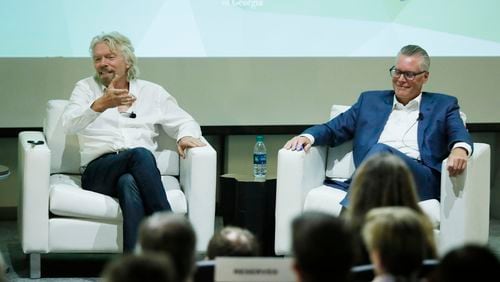 Delta CEO Ed Bastian and Virgin founder Richard Branson held a "fireside chat" event in Atlanta. BOB ANDRES  /BANDRES@AJC.COM